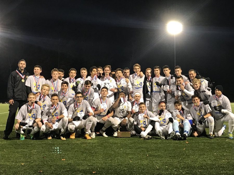 The+McQuaid+Jesuit+Soccer+Knights+take+a+team+photo+after+winning+the+Section+V+Championship+Game+against+Hilton+High+School.+