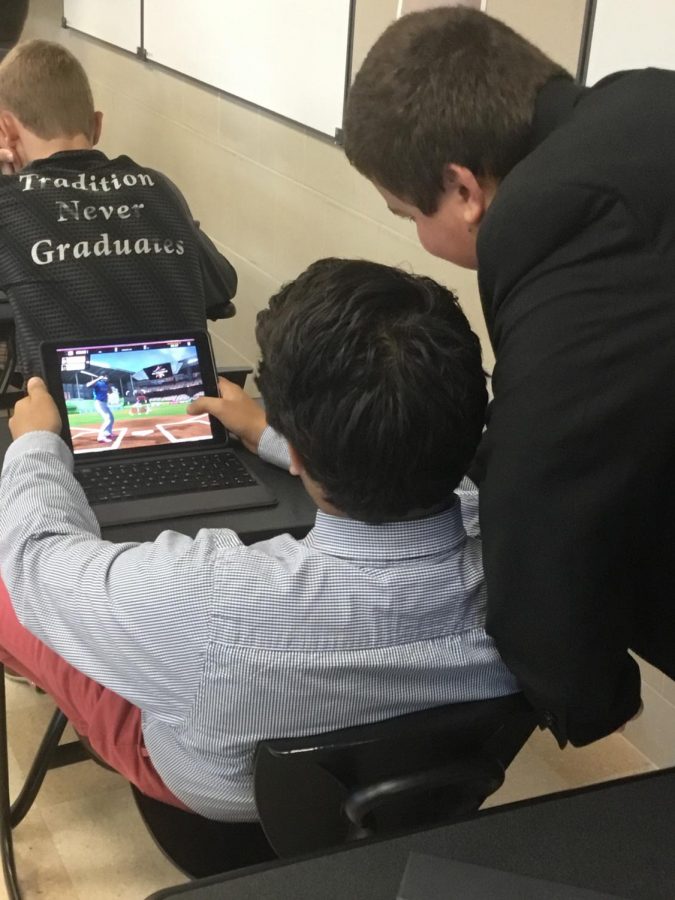 Karanveer Blagan uses his iPad to play a game to relax after English class.