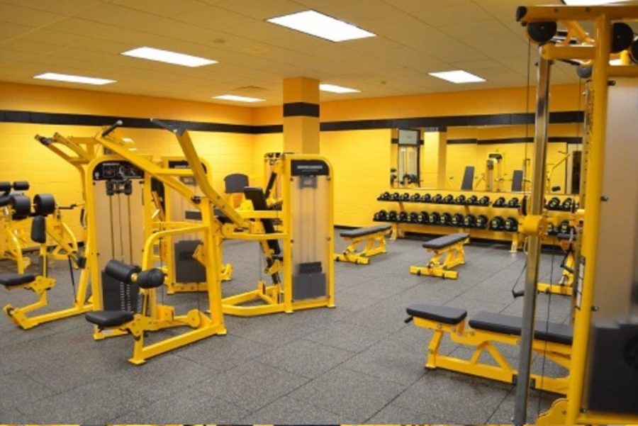 The+McQuaid+Jesuit+weight+room+includes+machines+and+dumbbells+in+one+section.+Most+individuals+spend+time+in+here.