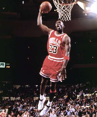 Jordan performs spectacular dunk, showing his amazing atheltic ability.