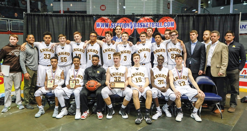 The McQuaid Basketball team after the big sectional title win against U PREP, March 3, 2018, Rochester N.Y, Blue Cross Arena. After starting 4-7, the Knights turned their season around to win their first sectional game in 15 years.