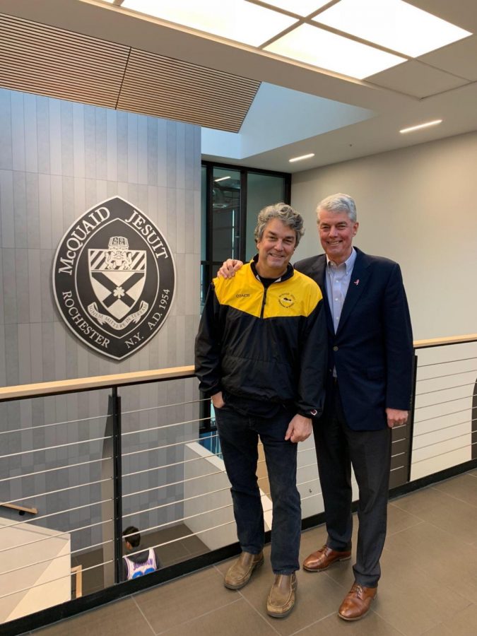 Mr. Maxwell, '75 and Dr. Maxwell, '67  pose in front of McQuaid's shield in the stem center. Dr. Maxwell and Mr. Maxwell are brothers.