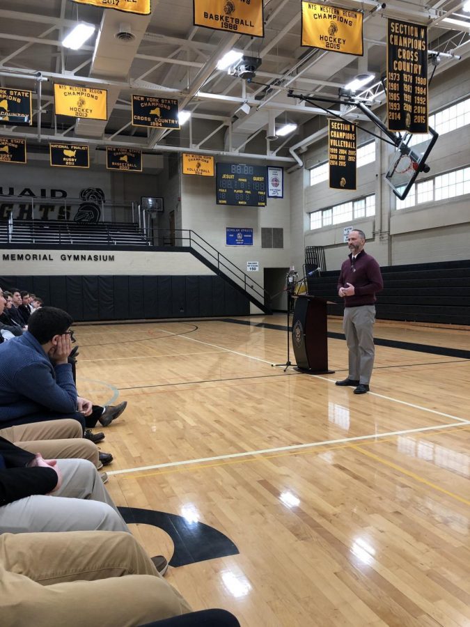 Mr. Doug Dolan, ‘88, speaks to the high school students in the John H. Ryan, Jr., Memorial Gymnasium about his struggles with addiction.