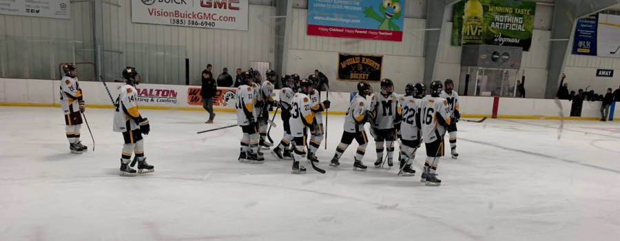 The Hockey Knights celebrate a win after defeating Rush-Henrietta at Thomas Creek arena Thursday.