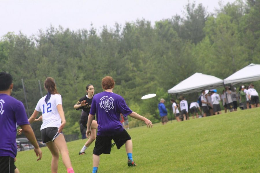 Sam Nix, 19, passes the disc downfield to Francesca Sorbello at the Ultimate New York State Championships.