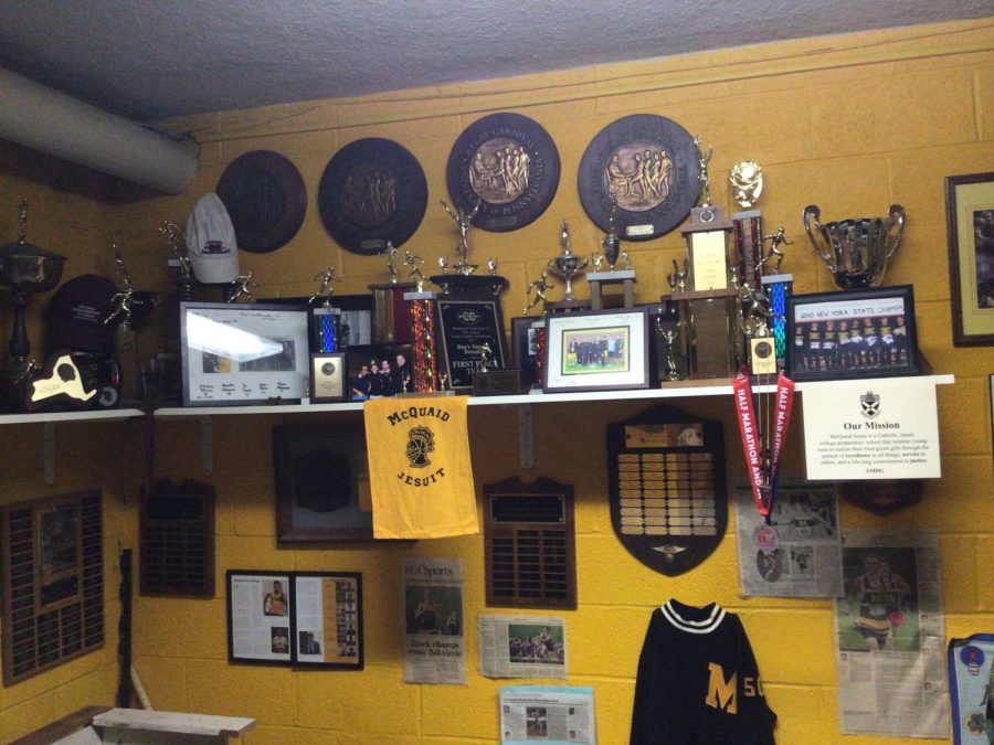 The shelf thats home to  valued plaques and pictures of some of the greatest runners to come through McQuaid. 