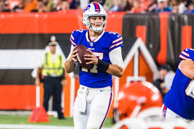 Buffalo Bills Quarterback Josh Allen attempts to throw a completion against Cleveland Browns. Allen set Franchise records during the 2020-21 season with 4,544 passin yards.