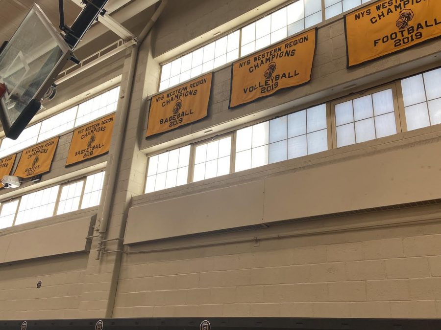 McQuaid Jesuit Volleyball 2019 NYS Western Regional Champions banner. The Knights defeated Clarence, a team from Buffalo, New York, in five sets to move onto the State Championship.(Similarity)